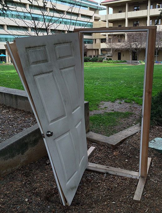 Borken door and frame in front of the oval